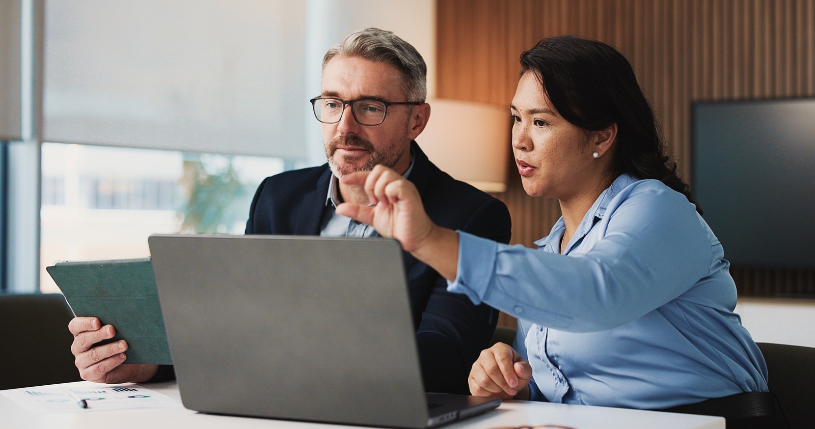 two business colleagues discussing franchise technology rollout